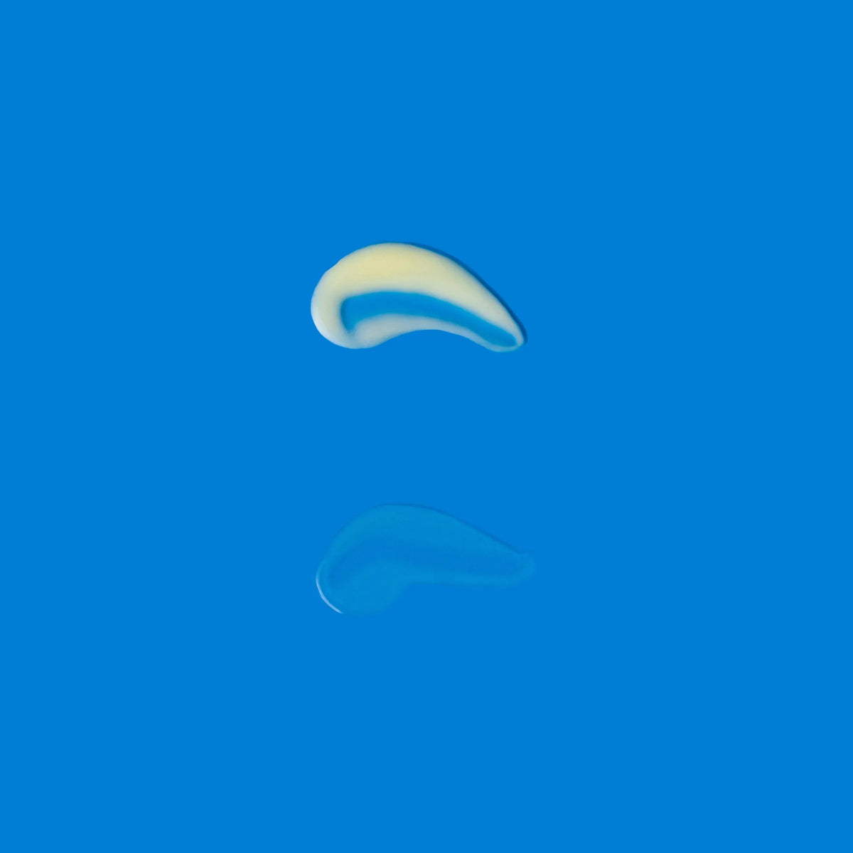 Smooth cream texture of Correct and Protect Duo shown with glossy refl