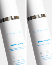 Total Protection SPF Duo showing sleek Mineral Fix³ and Clear Fusion sunscreen bottles with silver accents gallery 1